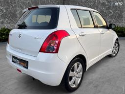 Zunanja slika - Suzuki Swift - 1.3 DELUXE DIG.KLIMA PERLA BELA SLOVENSKI ALU15 - 6 - Predogledna slika